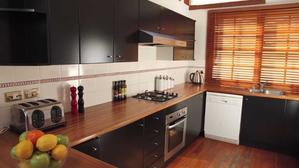 After - The painted kitchen cabinets are now darker